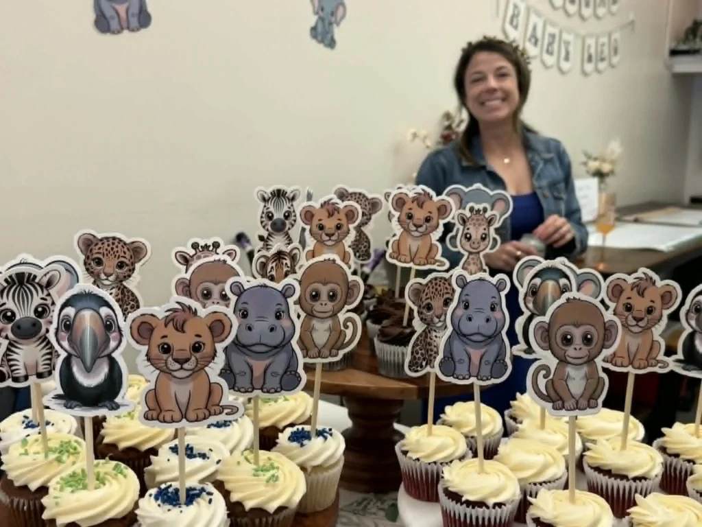 AI image cupcake toppers used at a baby shower with safari animal designs.